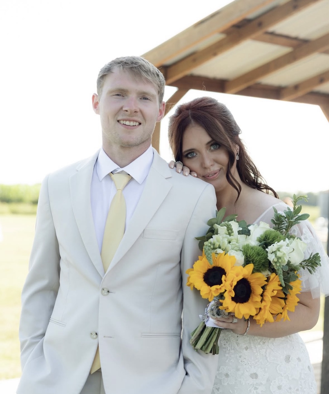Couple celebrating with Sie & Mo florals