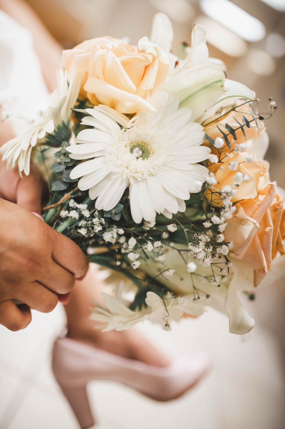 Peach-toned hand-tied bouquet by Sie & Mo Bouquet Co.